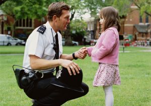 Officer talking to young girl 