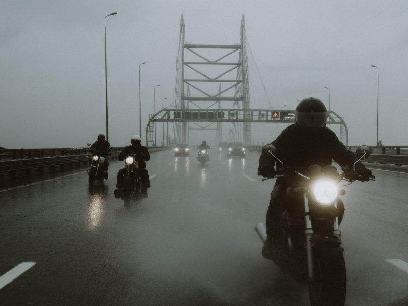 Motorcyclists riding in fog