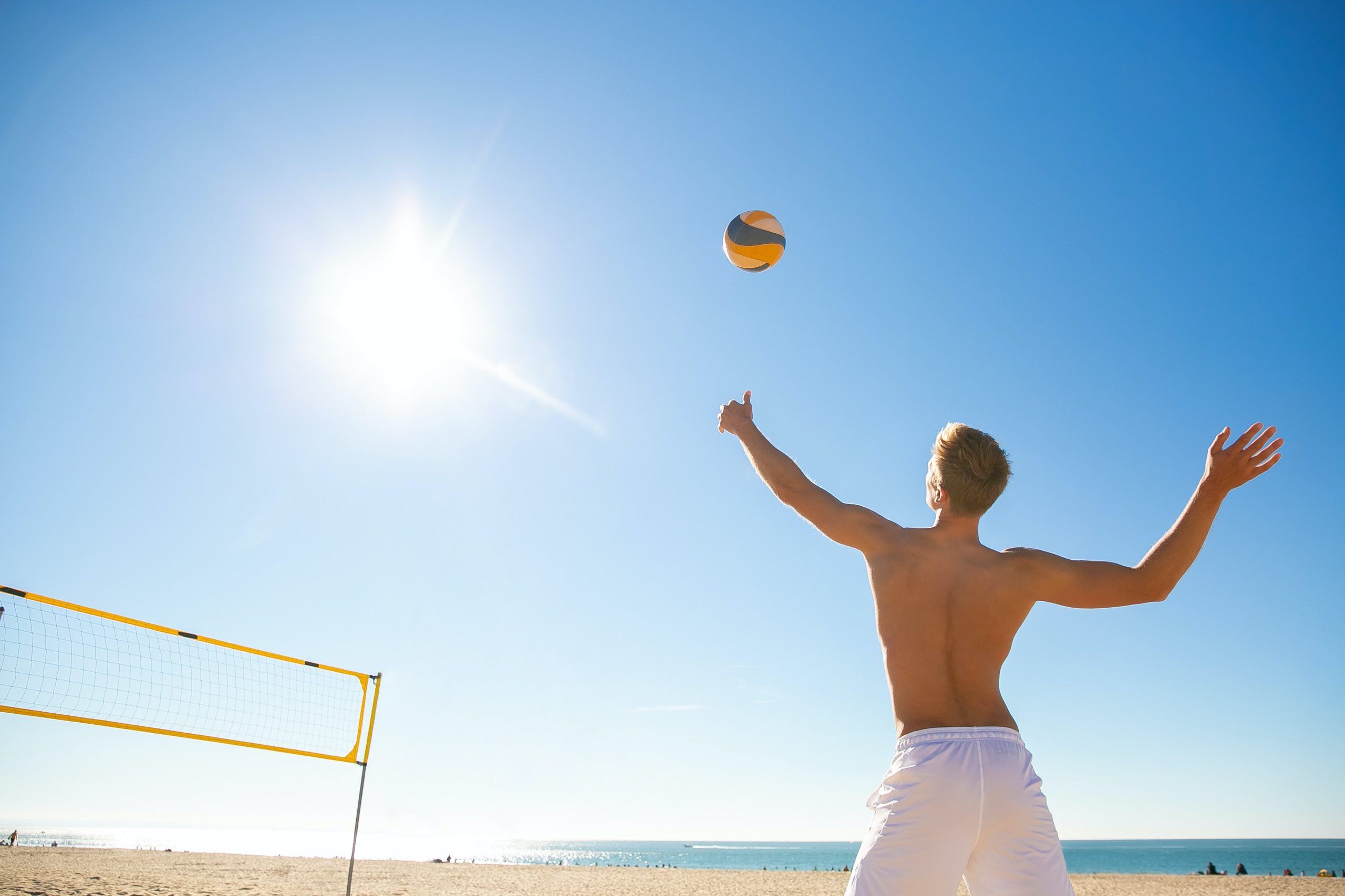 man playing beach volleyball