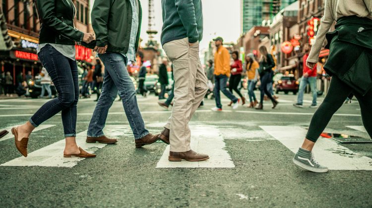 People walking across a crosswalk