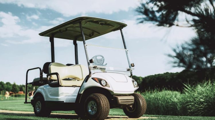 Golf cart on a golf course, illustrating common golf cart use.