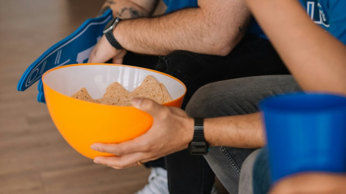 Super Bowl Sunday Study - men watching the game, eating chips and drinking