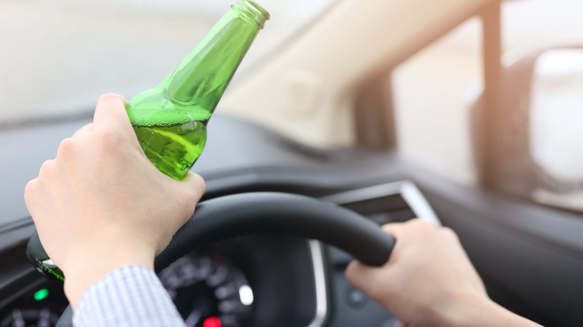 Man are drinking beer with alcohol while driving