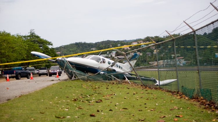small plane crashes through fence in emergency landing